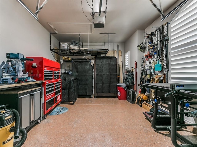 garage featuring a workshop area and a garage door opener