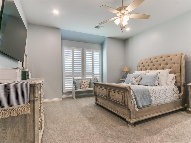 bedroom featuring visible vents, ceiling fan, light carpet, and baseboards