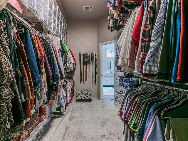 walk in closet featuring carpet floors and visible vents