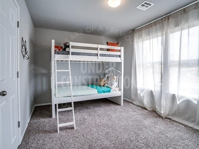 unfurnished bedroom with carpet floors, visible vents, and baseboards