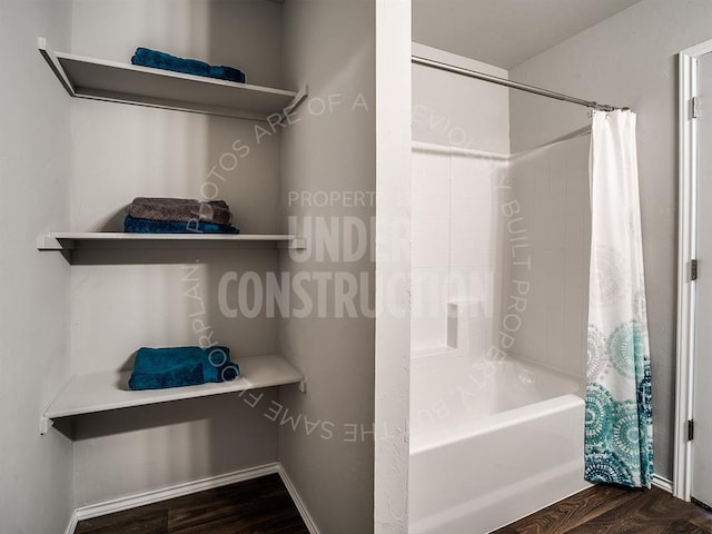 full bathroom featuring shower / bath combination with curtain and wood finished floors