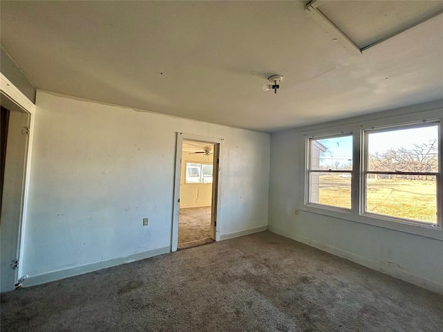 unfurnished bedroom with carpet floors and baseboards