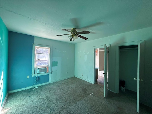 unfurnished bedroom featuring carpet, baseboards, ceiling fan, and cooling unit