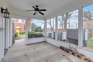 unfurnished sunroom with plenty of natural light and ceiling fan