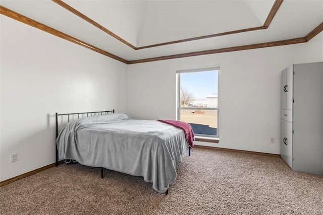 carpeted bedroom with ornamental molding and baseboards