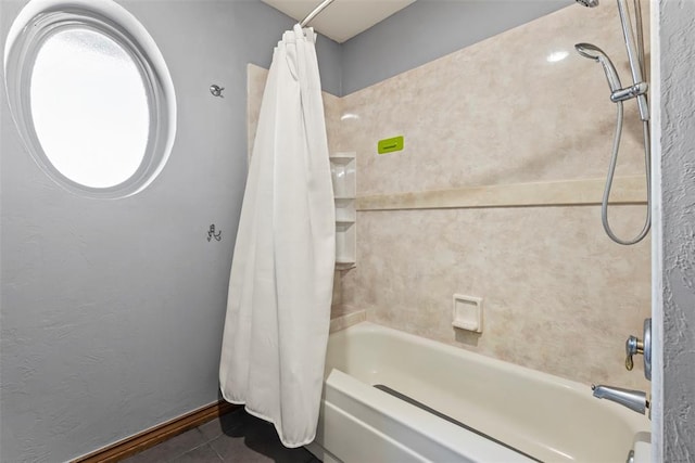 bathroom with tile patterned floors and shower / tub combo with curtain