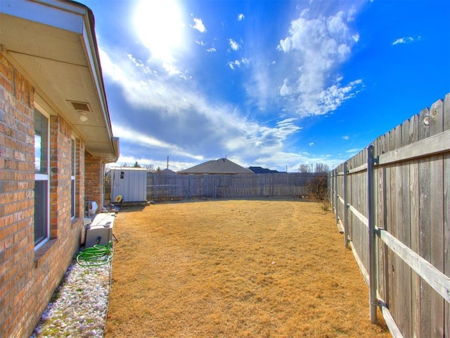 view of yard featuring a fenced backyard