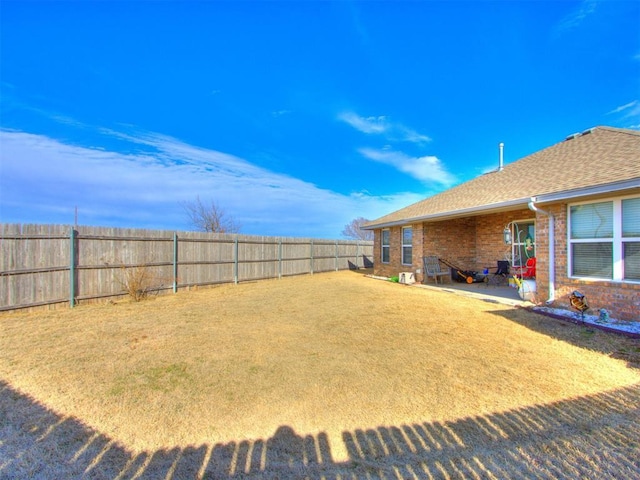 view of yard with a fenced backyard