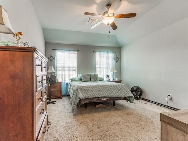 bedroom featuring visible vents, ceiling fan, and light carpet