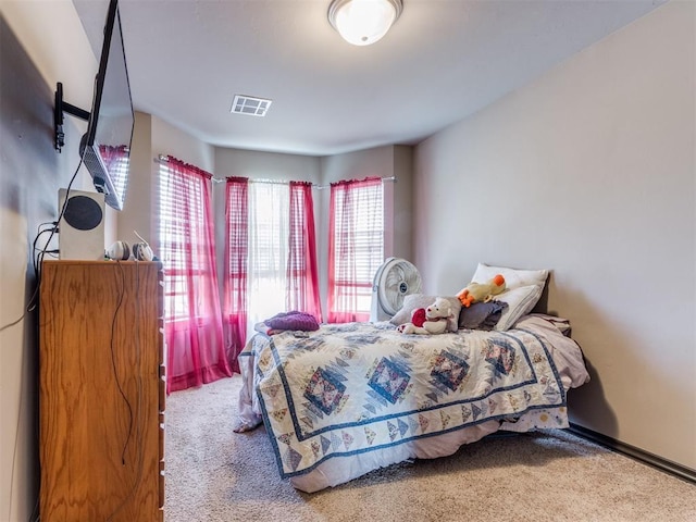 bedroom featuring visible vents and carpet flooring