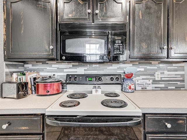 kitchen featuring black microwave, range with electric cooktop, light countertops, and backsplash