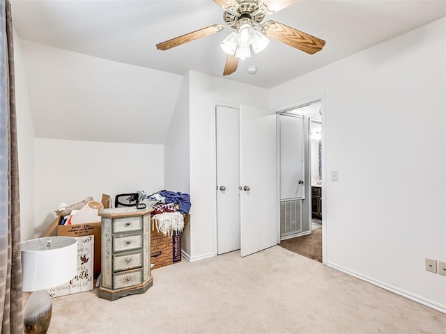 carpeted bedroom featuring lofted ceiling, ceiling fan, and baseboards