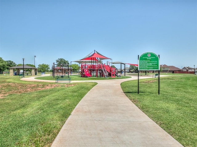 communal playground featuring a yard and a gazebo