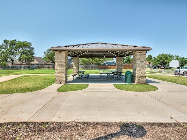 surrounding community featuring a yard, fence, a patio, and a gazebo