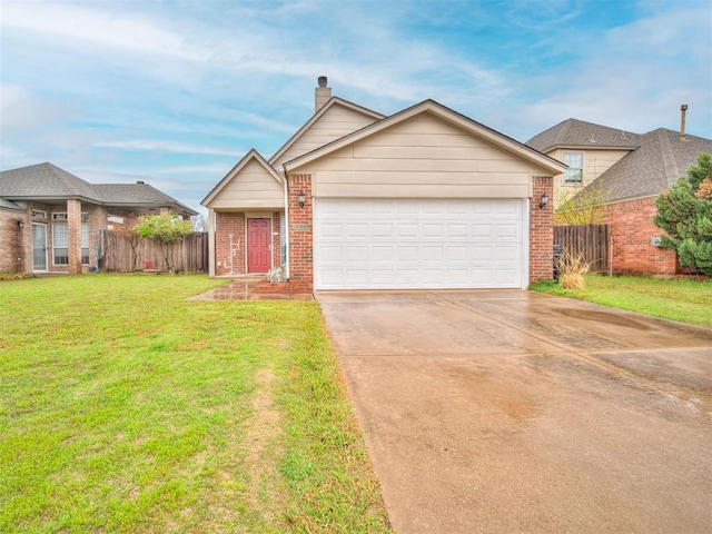 view of front facade with driveway, brick siding, an attached garage, fence, and a front yard