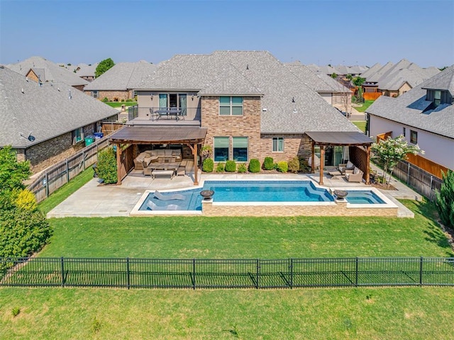 view of swimming pool featuring a fenced backyard, an outdoor living space, a patio, and a yard