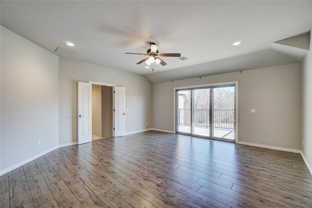 unfurnished room featuring visible vents, light wood-style flooring, a ceiling fan, vaulted ceiling, and baseboards