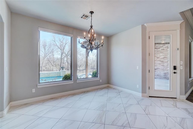 unfurnished dining area with baseboards, visible vents, and a notable chandelier