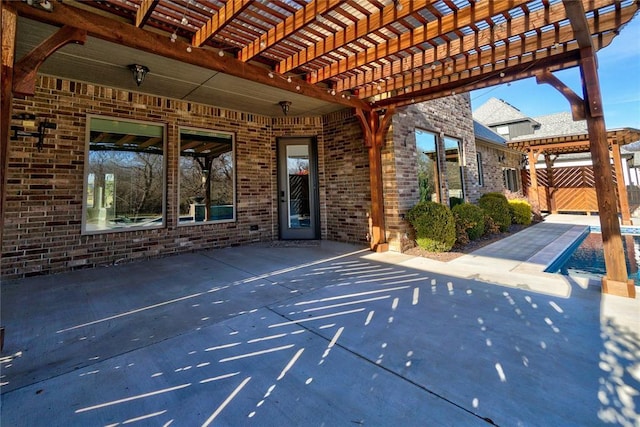 view of patio with fence, a fenced in pool, and a pergola