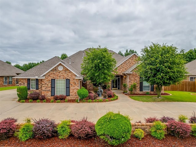 16632 Parkhurst Rd, Edmond, OK 73012 - view of front of house featuring brick siding and a shingled roof