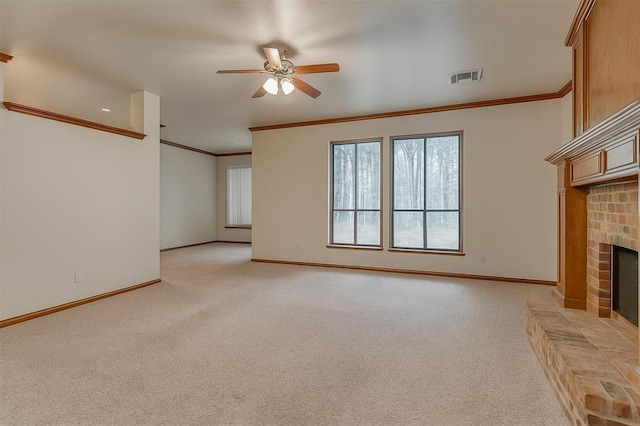 16632 Parkhurst Rd, Edmond, OK 73012 - unfurnished living room featuring light colored carpet, ornamental molding, ceiling fan, and a brick fireplace