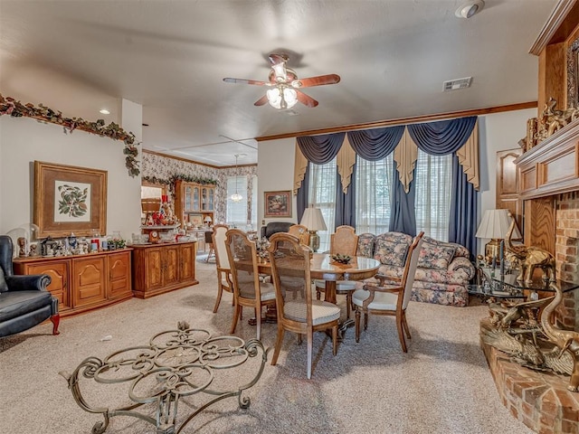 16632 Parkhurst Rd, Edmond, OK 73012 - dining room with light carpet, ceiling fan, and ornamental molding