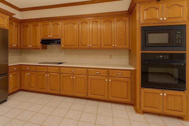 16632 Parkhurst Rd, Edmond, OK 73012 - kitchen featuring black appliances, under cabinet range hood, light countertops, brown cabinetry, and ornamental molding