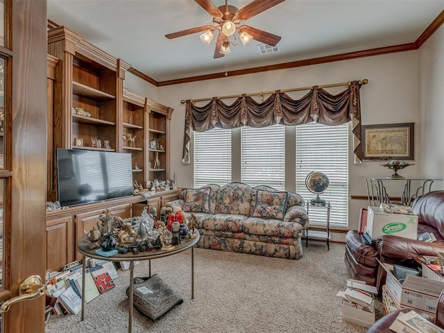 16632 Parkhurst Rd, Edmond, OK 73012 - living room featuring a ceiling fan, carpet floors, healthy amount of natural light, and crown molding