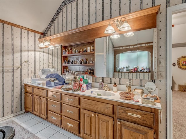 16632 Parkhurst Rd, Edmond, OK 73012 - bathroom featuring wallpapered walls, lofted ceiling, vanity, and tile patterned floors