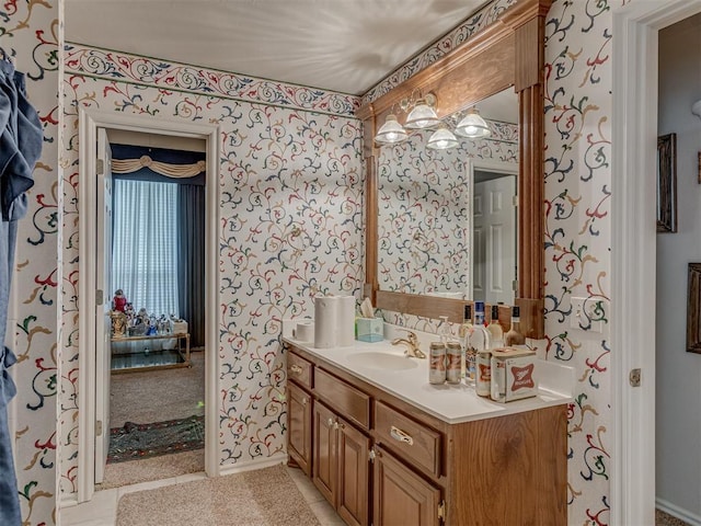 16632 Parkhurst Rd, Edmond, OK 73012 - bathroom featuring wallpapered walls, vanity, and tile patterned floors
