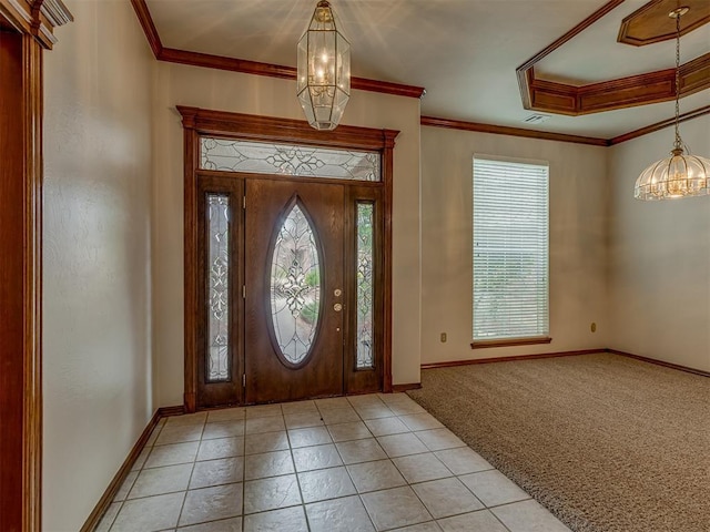 16632 Parkhurst Rd, Edmond, OK 73012 - foyer entrance featuring a chandelier, light tile patterned floors, light carpet, and crown molding