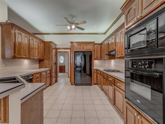16632 Parkhurst Rd, Edmond, OK 73012 - kitchen featuring black appliances, ceiling fan, light tile patterned floors, backsplash, and ornamental molding