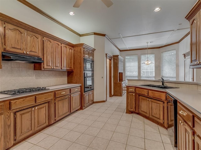 16632 Parkhurst Rd, Edmond, OK 73012 - kitchen with black appliances, under cabinet range hood, brown cabinetry, ornamental molding, and recessed lighting