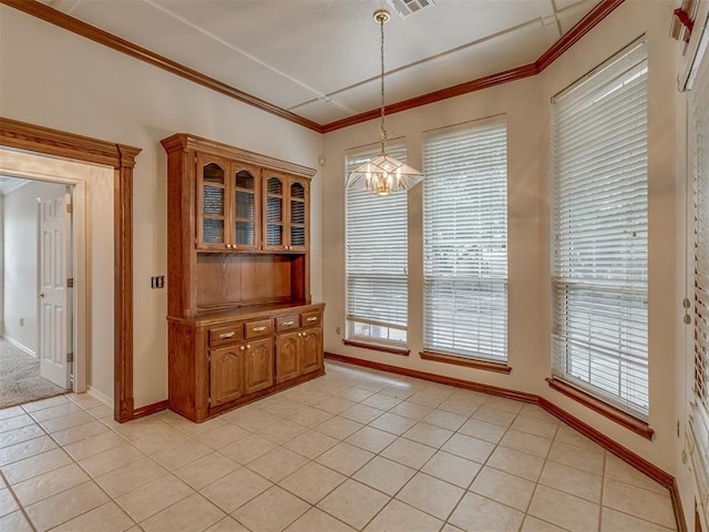 16632 Parkhurst Rd, Edmond, OK 73012 - unfurnished dining area with a chandelier, light tile patterned flooring, and ornamental molding