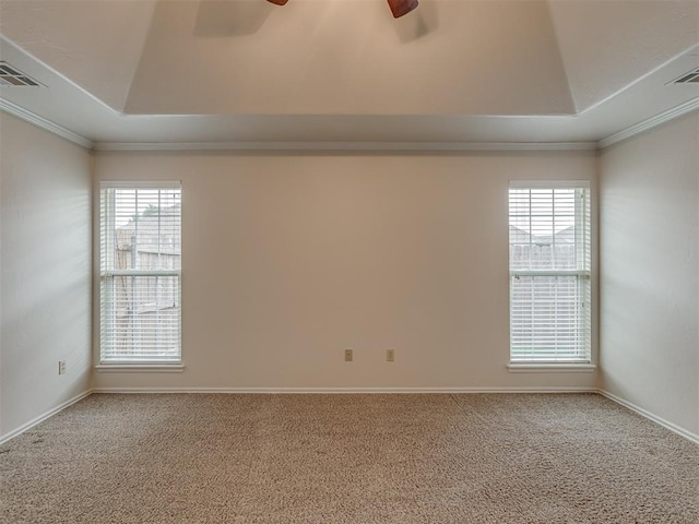 16632 Parkhurst Rd, Edmond, OK 73012 - carpeted empty room featuring ceiling fan, ornamental molding, and a raised ceiling