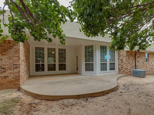 16632 Parkhurst Rd, Edmond, OK 73012 - back of property with a patio area and roof with shingles