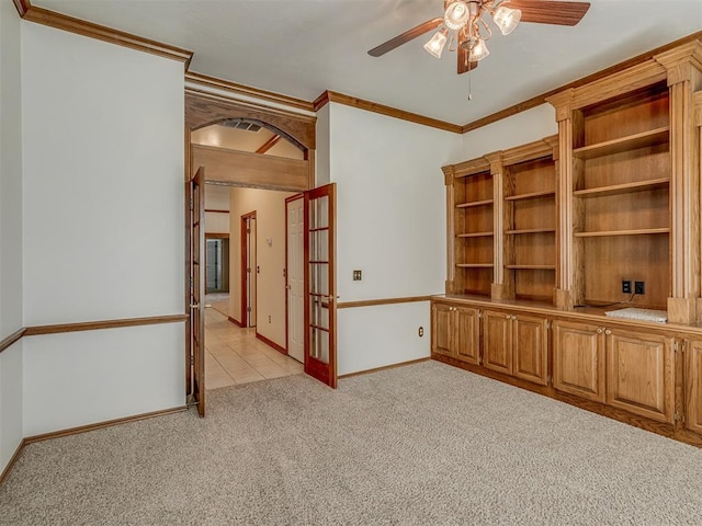 16632 Parkhurst Rd, Edmond, OK 73012 - unfurnished room featuring light colored carpet, ceiling fan, crown molding, and french doors