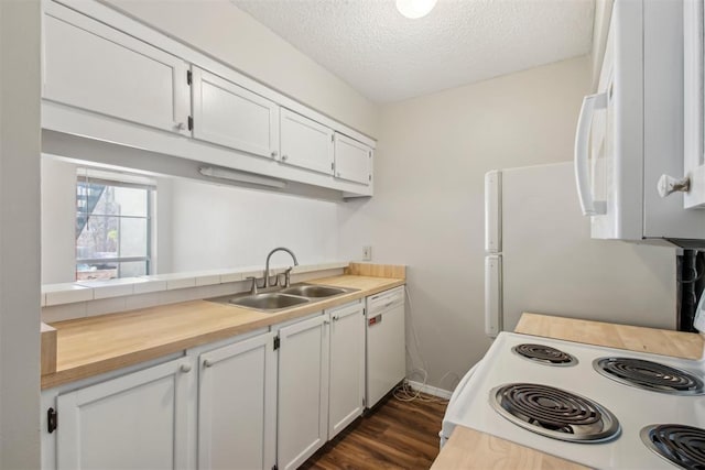 kitchen with dark wood-type flooring, white cabinetry, a sink, a textured ceiling, and white appliances