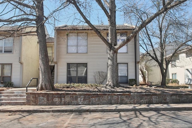 view of front facade featuring stairs