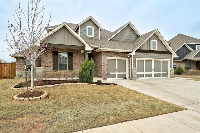 craftsman inspired home featuring concrete driveway, brick siding, board and batten siding, and roof with shingles