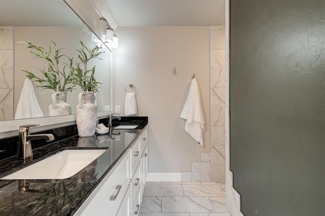 12709 Pinewood Ln, Oklahoma City, OK 73142 - full bath featuring double vanity, marble finish floor, and a sink