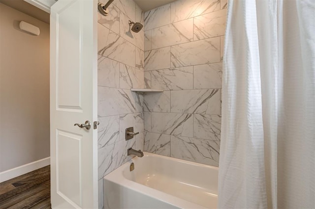 12709 Pinewood Ln, Oklahoma City, OK 73142 - bathroom featuring shower / tub combo, baseboards, and wood finished floors