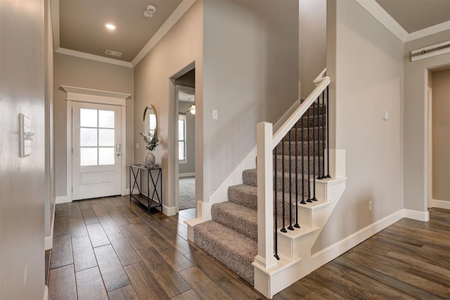 12709 Pinewood Ln, Oklahoma City, OK 73142 - entrance foyer featuring stairway, visible vents, ornamental molding, dark wood-type flooring, and baseboards