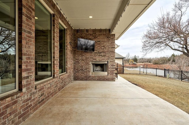 12709 Pinewood Ln, Oklahoma City, OK 73142 - view of patio / terrace with an outdoor brick fireplace, a water view, and fence