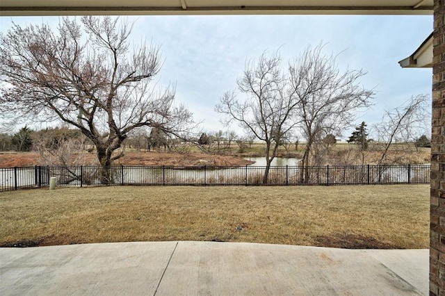 12709 Pinewood Ln, Oklahoma City, OK 73142 - view of yard with fence and a water view