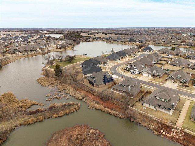 bird's eye view with a water view and a residential view