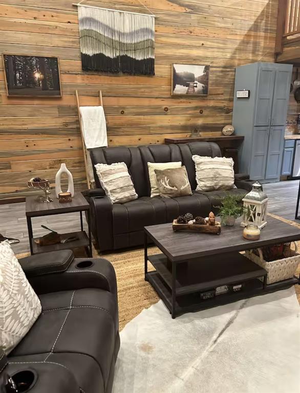 living room featuring wood walls