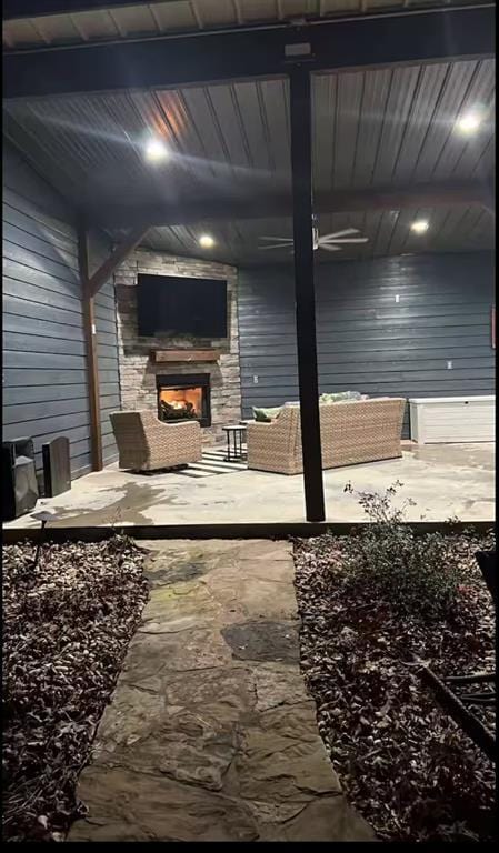 miscellaneous room featuring wood walls, a fireplace, and wooden ceiling