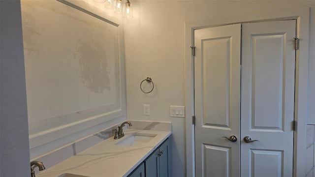 bathroom featuring double vanity and a sink