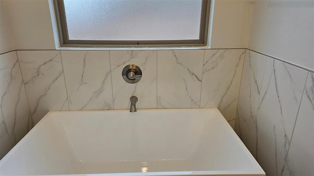 bathroom featuring a washtub